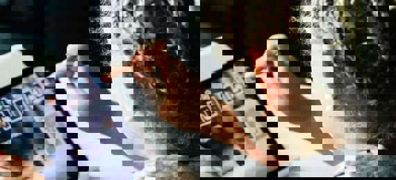 A child selecting apps on a tablet.