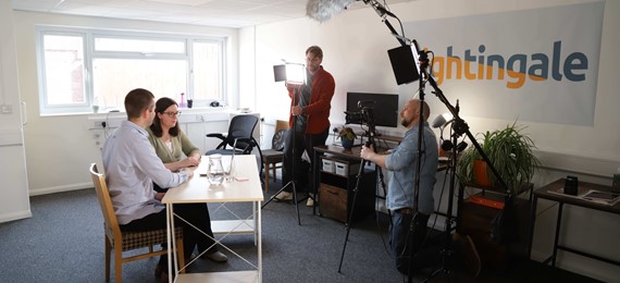 Image of Michael and Frances being filmed
