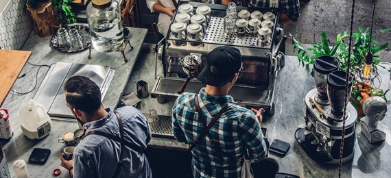 Two people working at a coffee shop