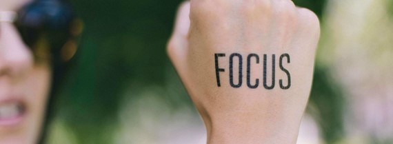 Image of fist with the word 'focus' stencilled on it