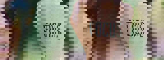 Image of fist with the word 'focus' stencilled on it