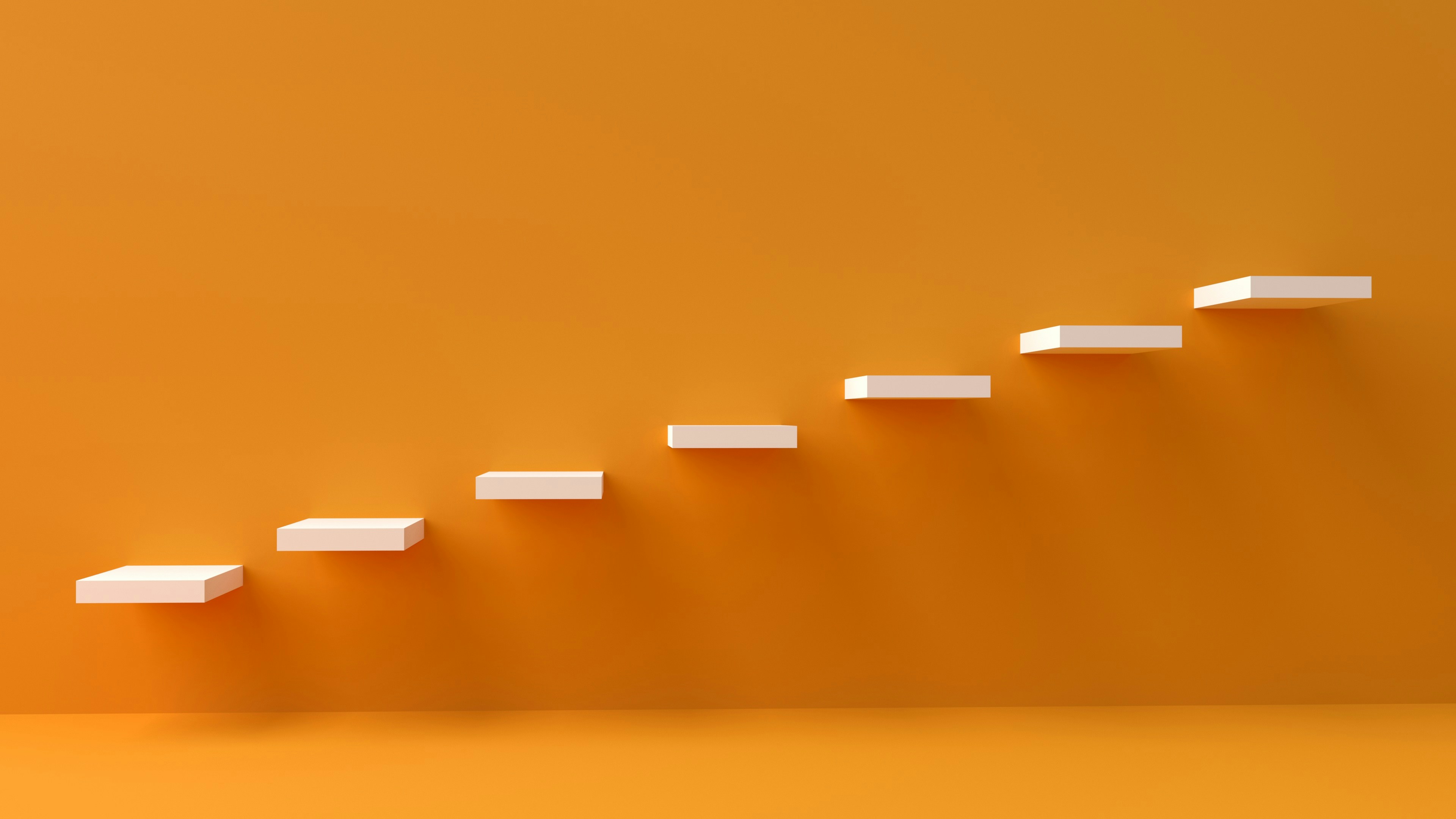 Stylised image of steps going up an orange wall